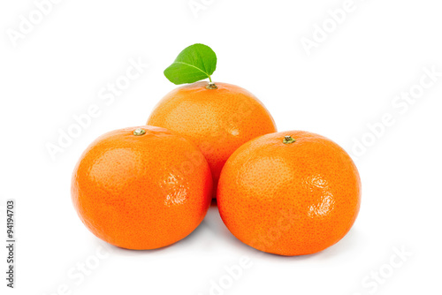 Three ripe tangerines isolated