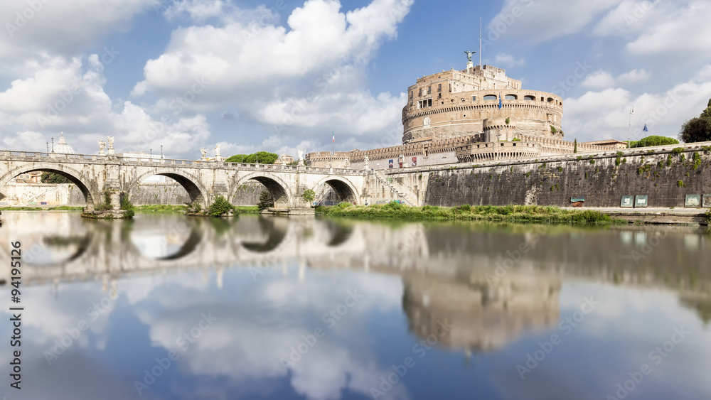 Bridge and Castle Sant Angelo with reflection in the water in Ro