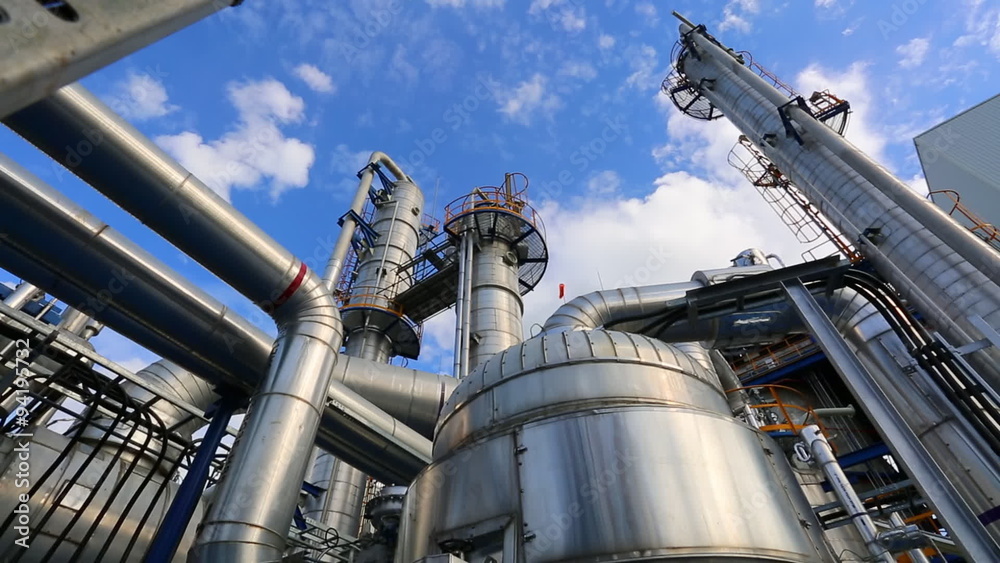 Time lapse of Refinery tower structure in process area of refinery plant with blue sky 