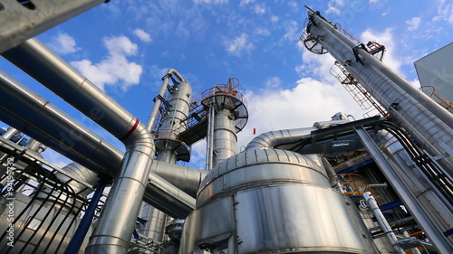 Time lapse of Refinery tower structure in process area of refinery plant with blue sky 