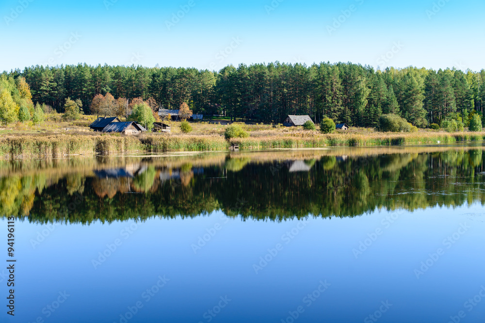 Fototapeta premium Colorful landscape with a abandoned village on the shore of fore