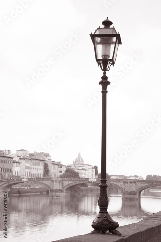 Lamppost and Ponte Santa Trinita Bridge with Arno River; Florenc photo