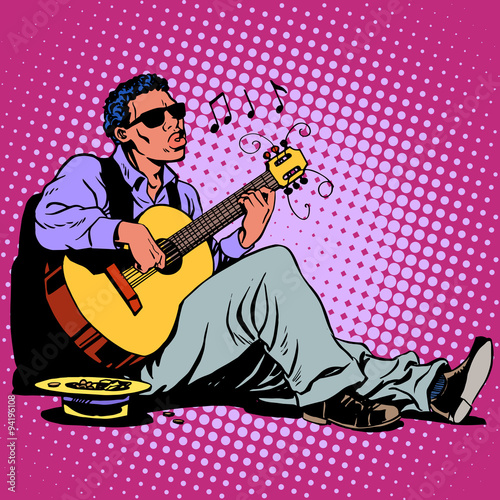 Street Blues musician of African descent with a guitar