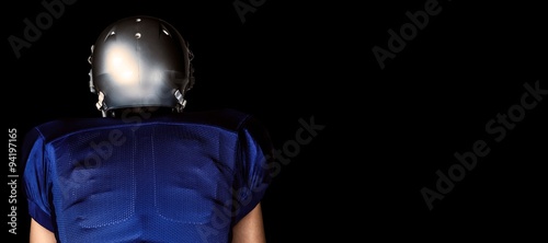 Fototapeta Naklejka Na Ścianę i Meble -  Composite image of rear view of american football player