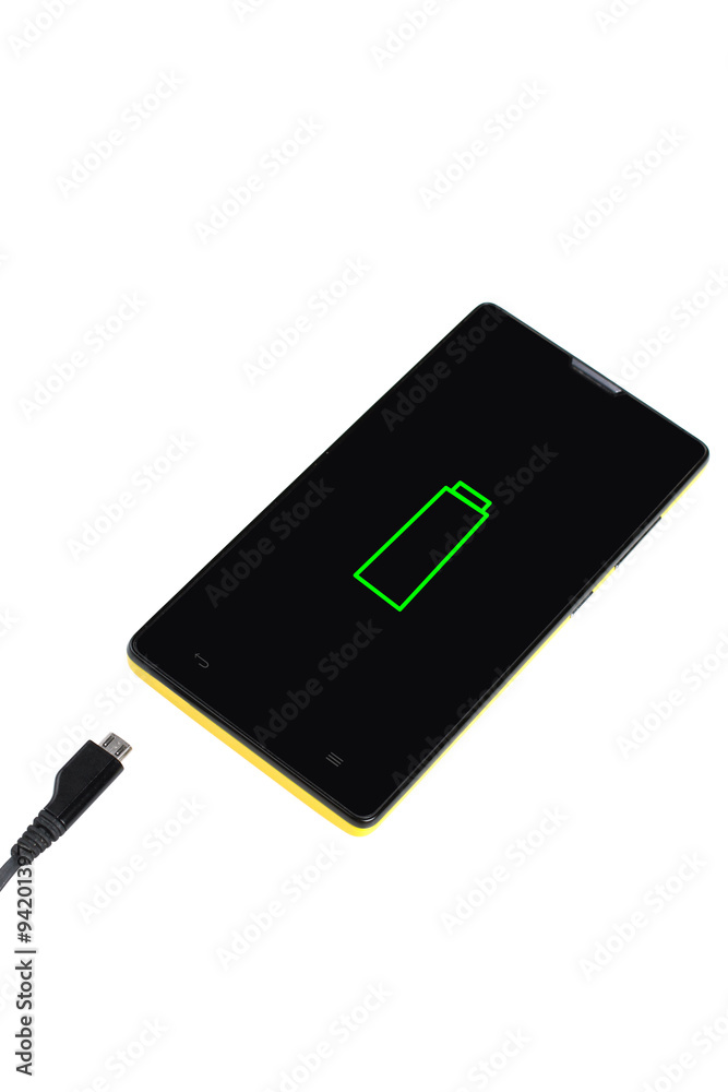 a discharged cell phone with charger isolated on white background a discharged cell phone with charger isolated on white background