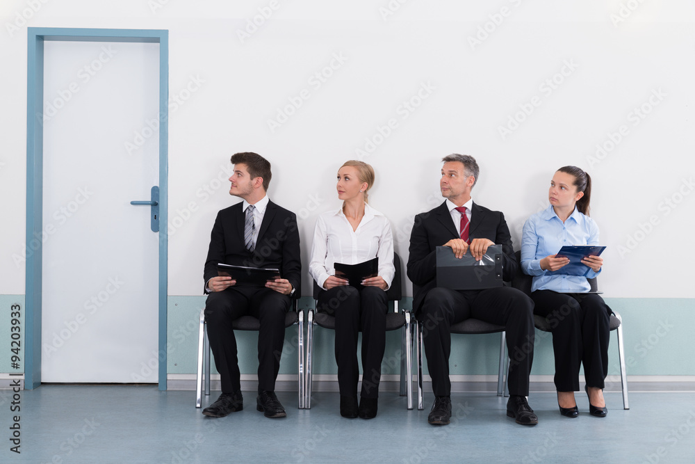 Businesspeople Sitting On Chair For Giving Interview Businesspeople Sitting On Chair For Giving Interview