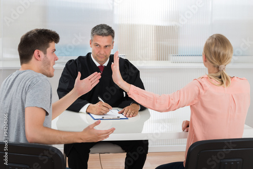 Couple Having An Argument In Front Of Judge photo