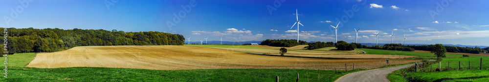 Wind turbine generating electricity in a beautiful valley Wind turbine generating electricity in a beautiful valley