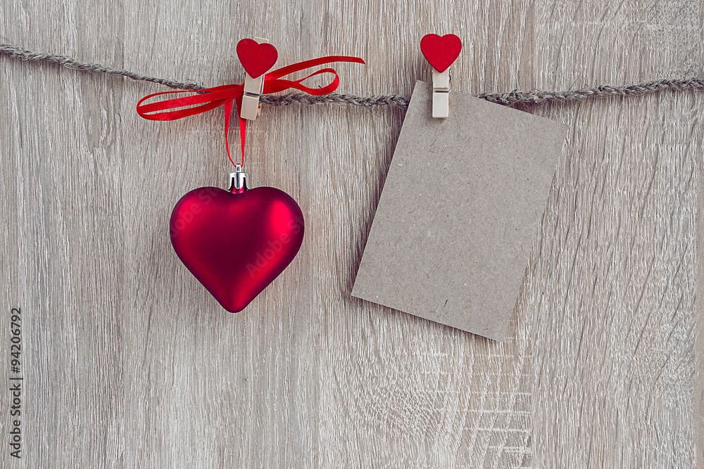 Fototapeta premium Christmas decorations with a blank card hanging over wooden back