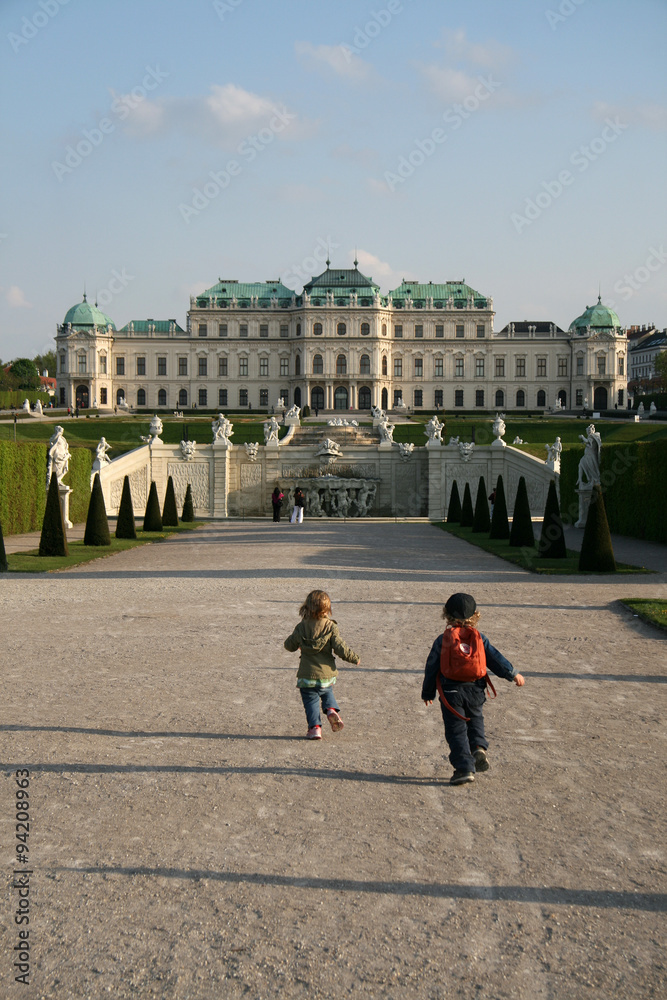 VIENNA, AUSTRIA - APRIL 22, 2010: Running children in Belvedere Palace Gardens in Vienna, Austria