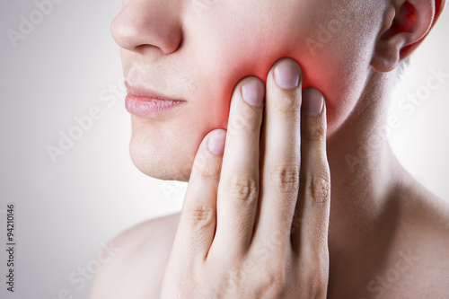 Man with a toothache. Pain in the human body photo