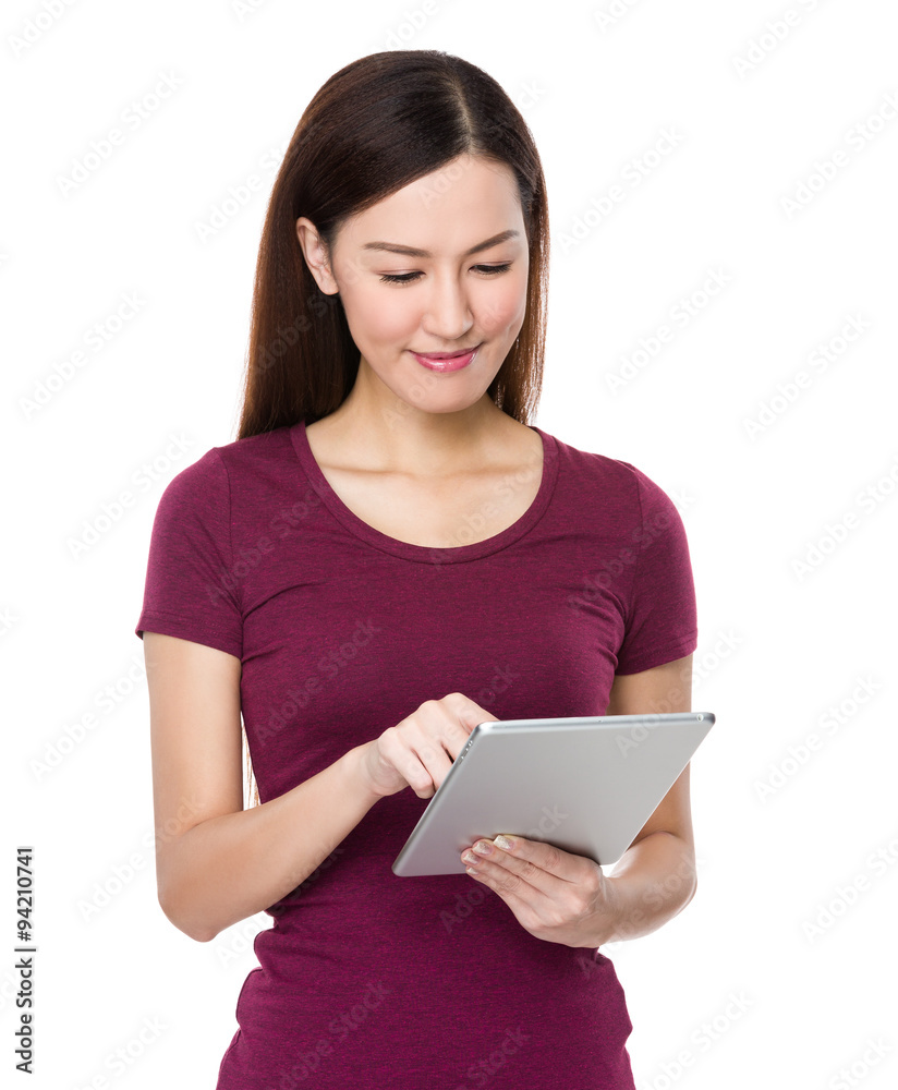 Asian Young Woman use of the digital tablet pc Asian Young Woman use of the digital tablet pc