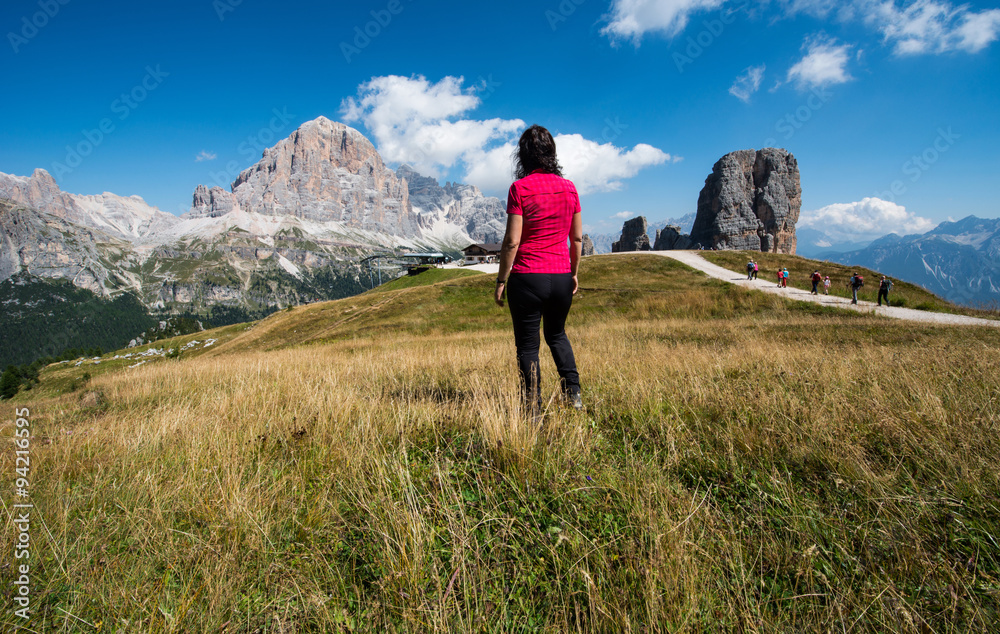 Woman is watching Cinque Torri panorama, Dolomites