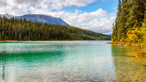 Turquoise color of First Lake along the hiking trail of the Valley of Five Lakes in Jasper National Park in the Canadian Rockies