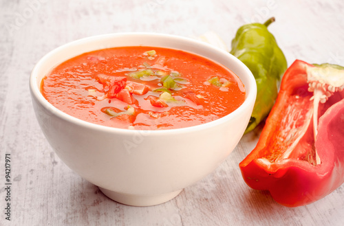 Andalusian gazpacho in white porcelain bowl photo