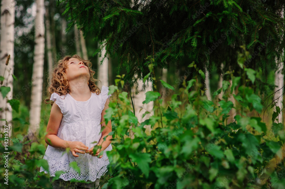 child girl exploring nature on the walk in summer forest on vacation child girl exploring nature on the walk in summer forest on vacation