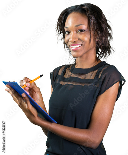 Portrait of happy African American business woman holding clipboard