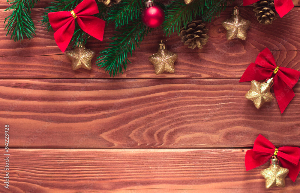 Christmas fir tree with decoration on dark wooden board. Soft fo Christmas fir tree with decoration on dark wooden board. Soft fo