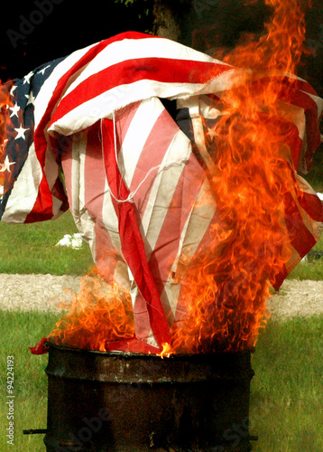 Obraz na płótnie Flag burning at a flag retirement ceremony. w salonie
