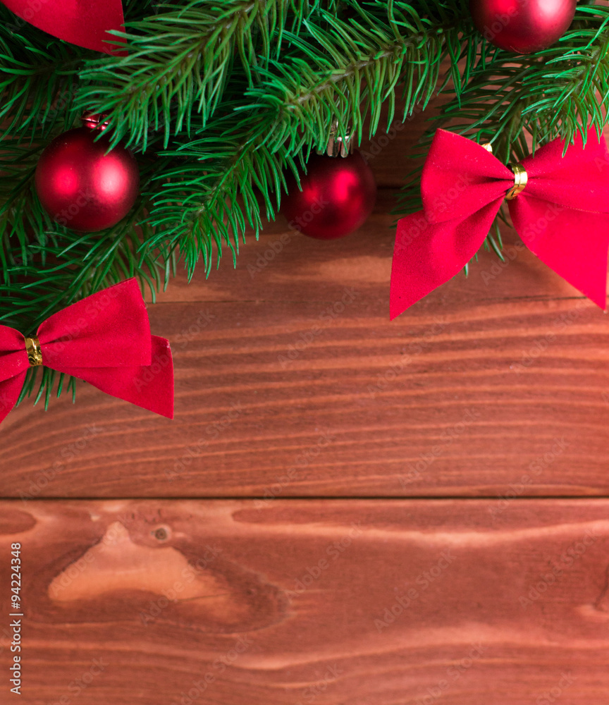 Christmas fir tree with decoration on dark wooden board. Soft fo Christmas fir tree with decoration on dark wooden board. Soft fo