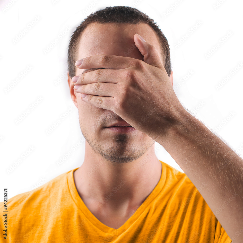 Fototapeta premium Man covering his eyes with his hand