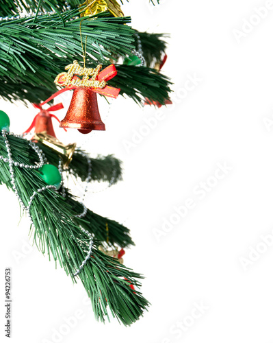 Christmas bell and new year beads on the branch of a tree
