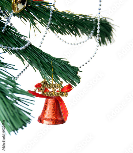 Christmas bell and new year beads on the branch of a tree