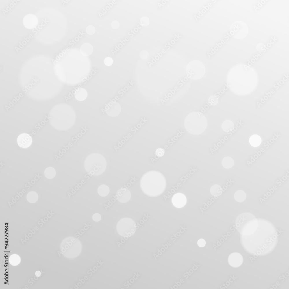 Delicate bokeh gray abstract background, winter theme, blurry snowflakes Delicate bokeh gray abstract background, winter theme, blurry snowflakes
