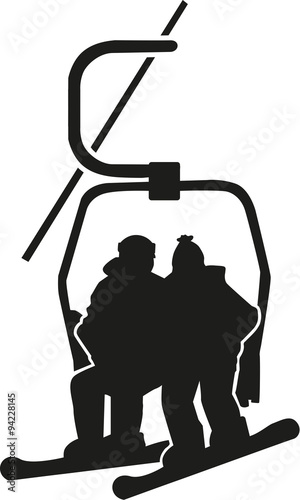 Snowboarder sitting in a chairlift