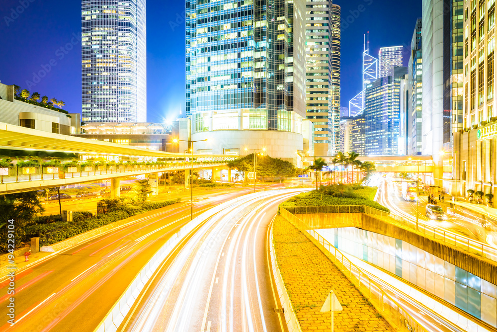 Traffic light at night and Business center building at Hong kong