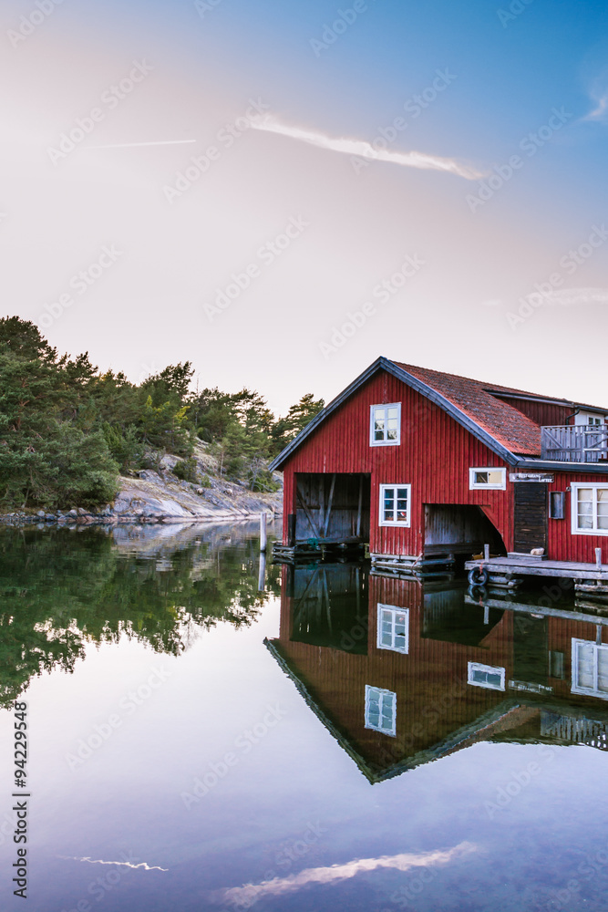 Fototapeta premium Classic red boat house in the island Harstena in Sweden