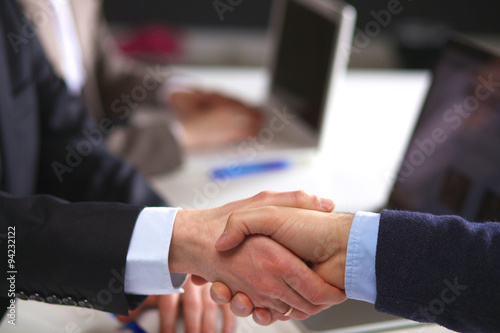 Business handshake. Two businessman shaking hands with each