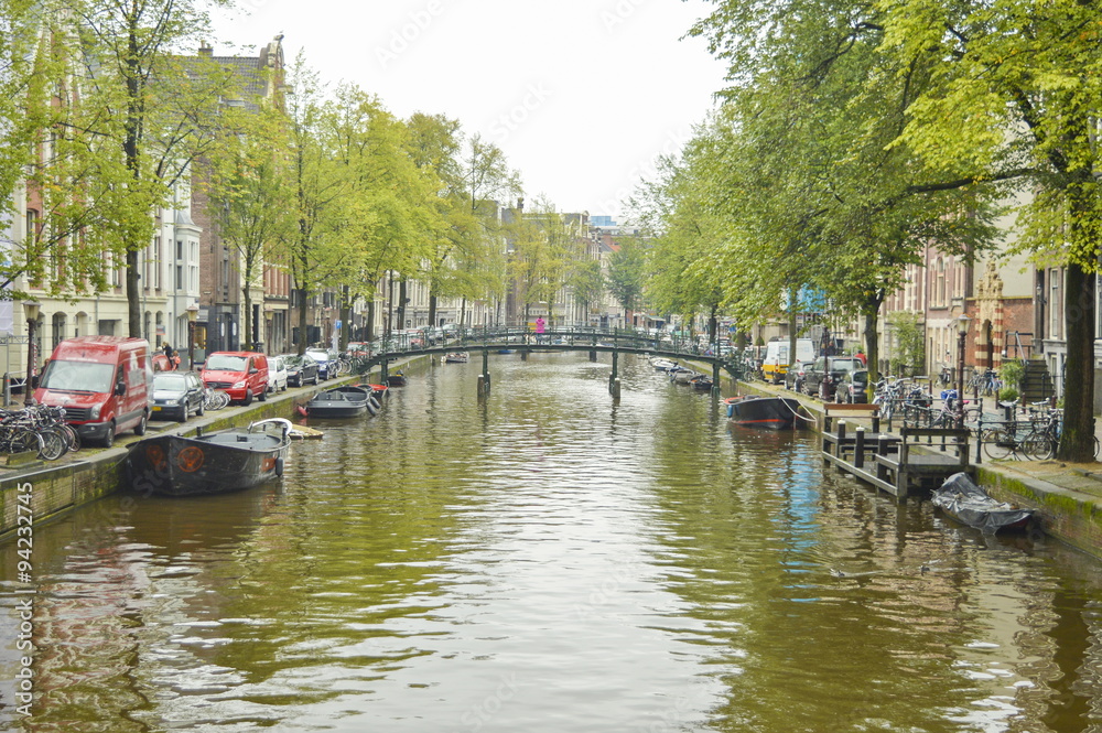 Amsterdam city canal on a cloudy autumn day
