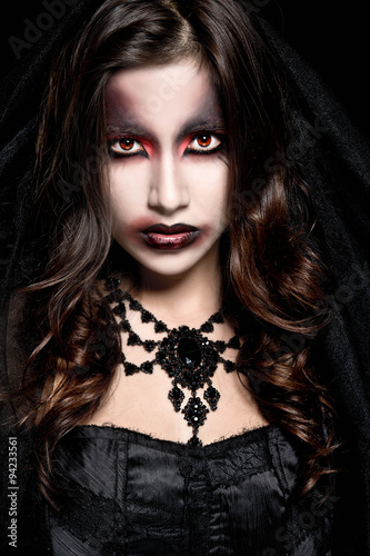 Portrait of a pale gothic vampire woman. Halloween Make up. 
