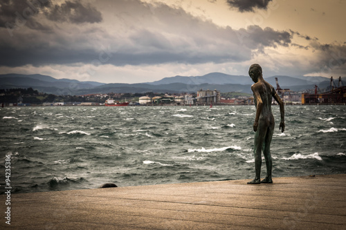 Statue of child by the sea