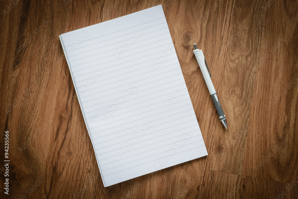 blank page of notebook and white pencil, business concept blank page of notebook and white pencil, business concept