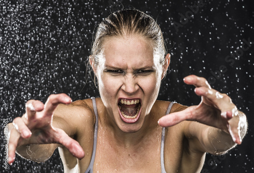 Angry Female Fighter Reaching Hands Towards Camera