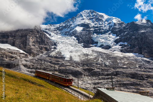Train running under the Monch and Eiger glacier