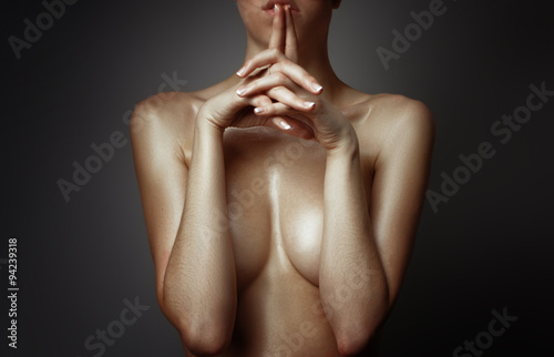 Fototapeta Topless woman body covering her big breast