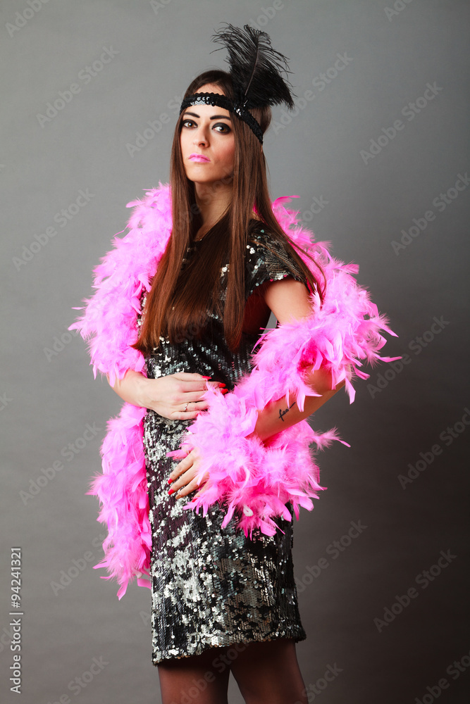 Girl pink plume and black feather on head. Carnival. Girl pink plume and black feather on head. Carnival.