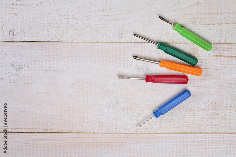 Set of screwdrivers on white wooden rustic background .Housework, tools, DIY concept Set of screwdrivers on white wooden rustic background .Housework, tools, DIY concept