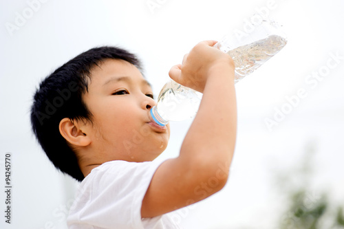 Boy drink water from bottle