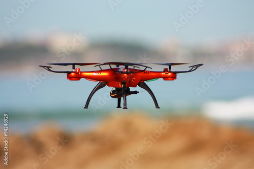 Quadrocopter flying on the beach