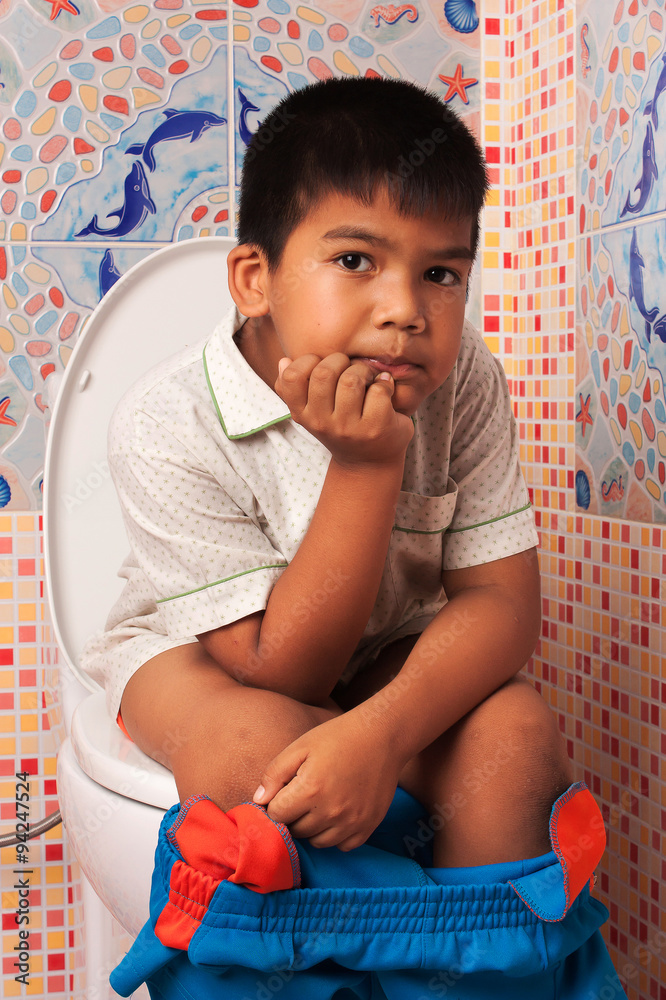 little asian boy defecate in toilet background Stock Photo Adobe Stock