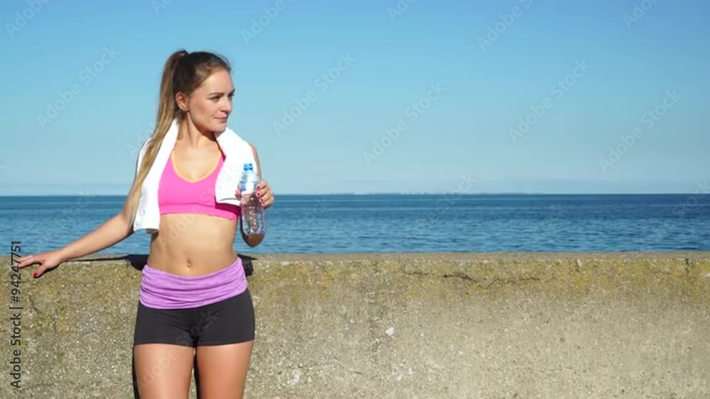 Woman drinking water after sport gym outdoor 4K Woman drinking water after sport gym outdoor 4K