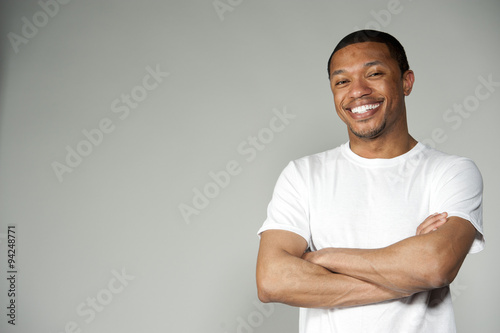 Fotografie Trendy Happy and Fun Black Male Wearing A White Top