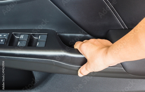 Hand on handle. Close-up of man in closeing a car door