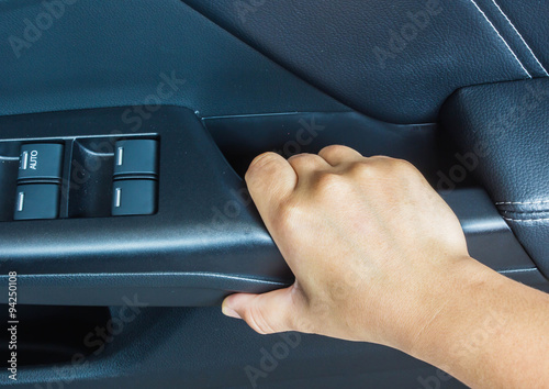 Hand on handle. Close-up of man in closeing a car door