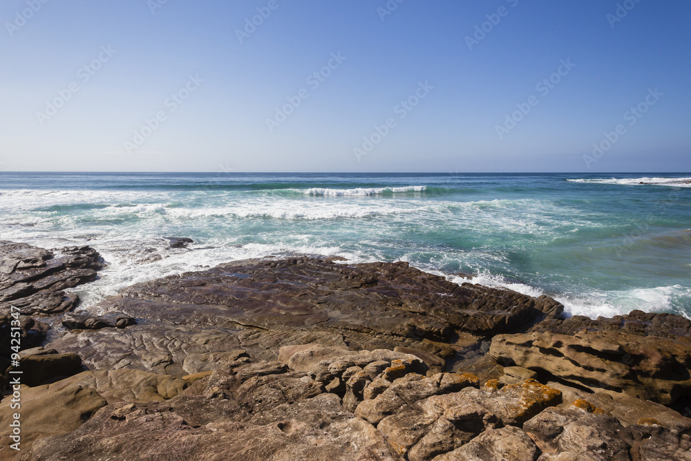 Ocean Rocky Coastline with blue water waves landscape