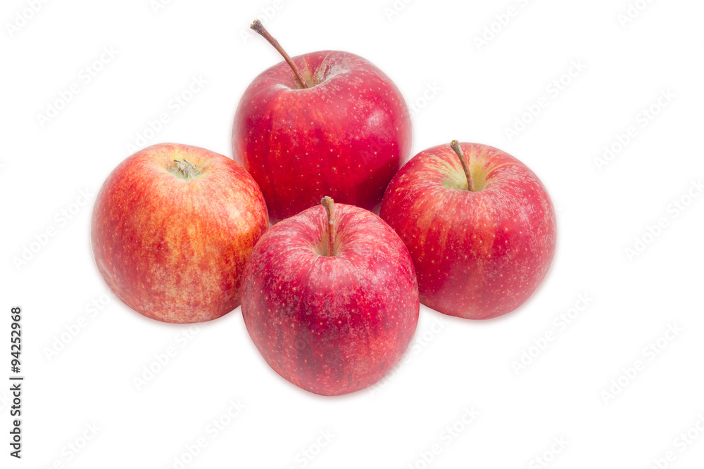 Four red apples on a light background Four red apples on a light background
